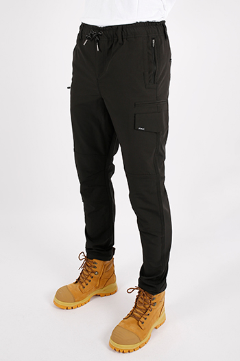 A person wearing black pants and brown boots    Description automatically generated